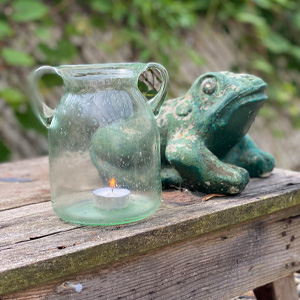 Lighting and a frog décor for outdoor decorating with Goodwill